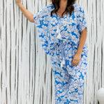 lady wearing blue floral outfit of kaftan top and palazzo relaxed fit pants