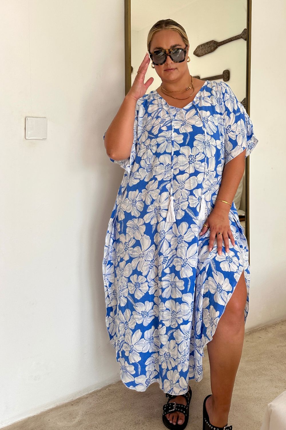 Woman wearing a blue floral dress in Bali villa