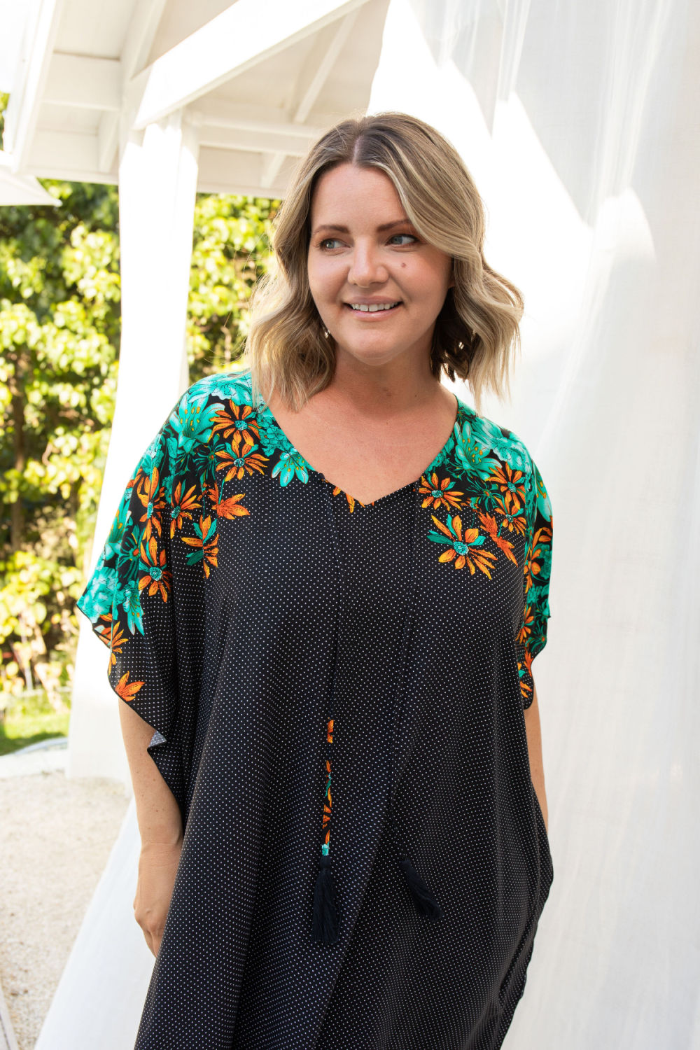 long-kaftan-dress-black-polka-orange-green-floral-close-up