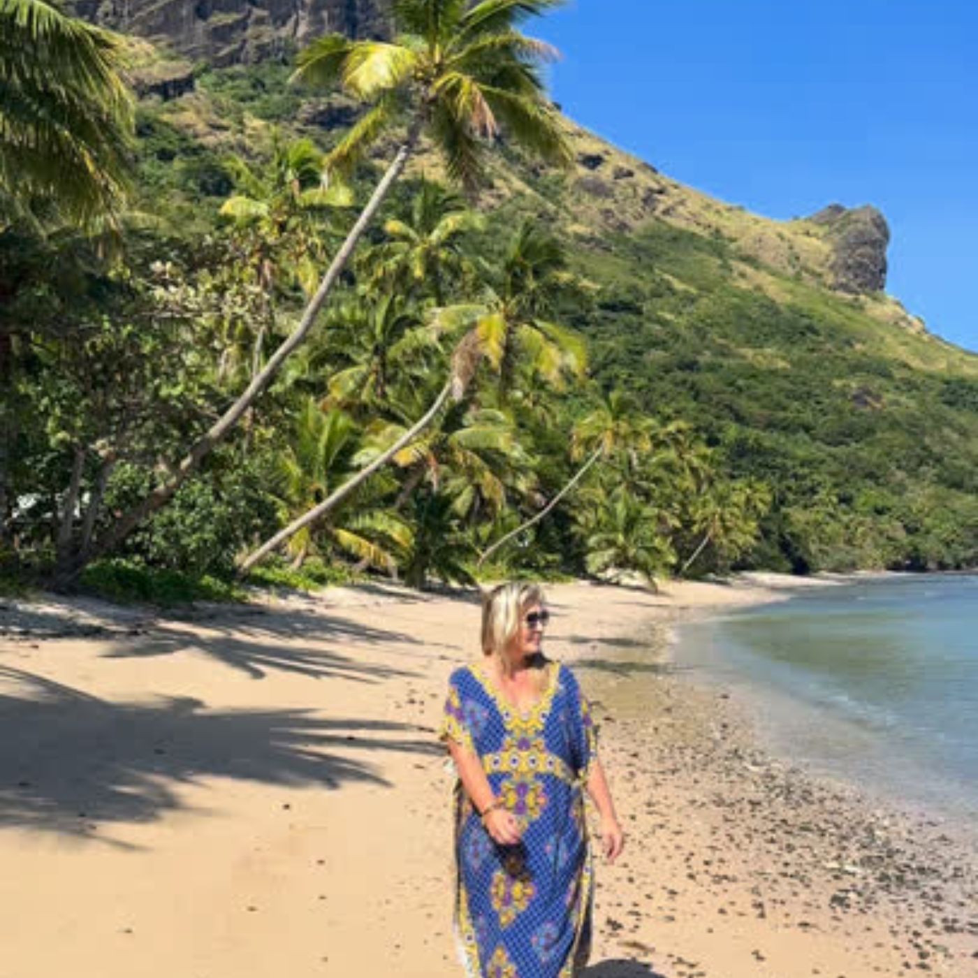Regina wearing a Holley Day long kaftan on the beach in Fiji