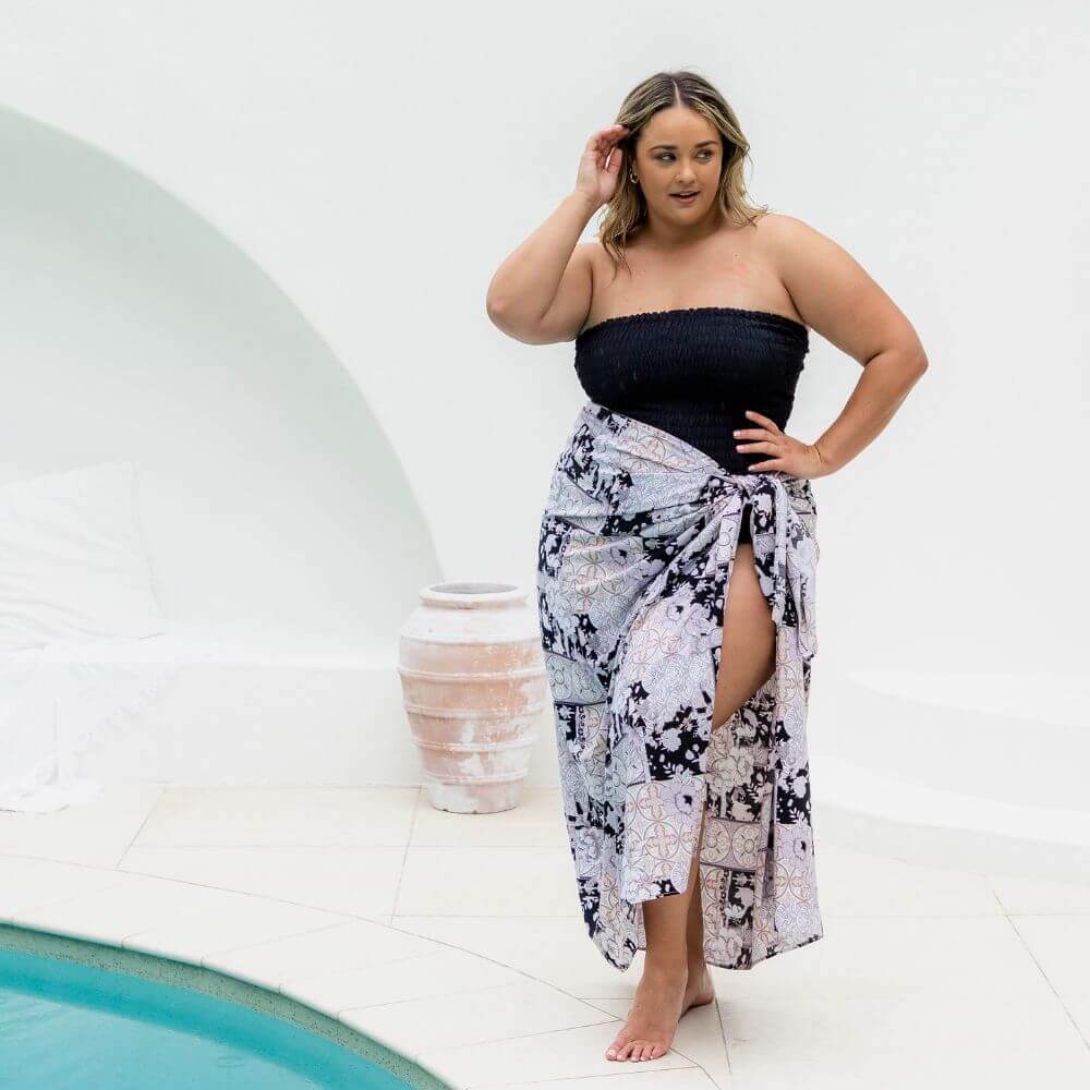 Plus size model wrapped in plus size sarong featuring black Mandala and floral print design