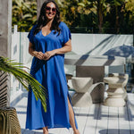 Lagoon Blue long kaftan dress worn loose, showing the side split, V-neckline and full-length silhouette.