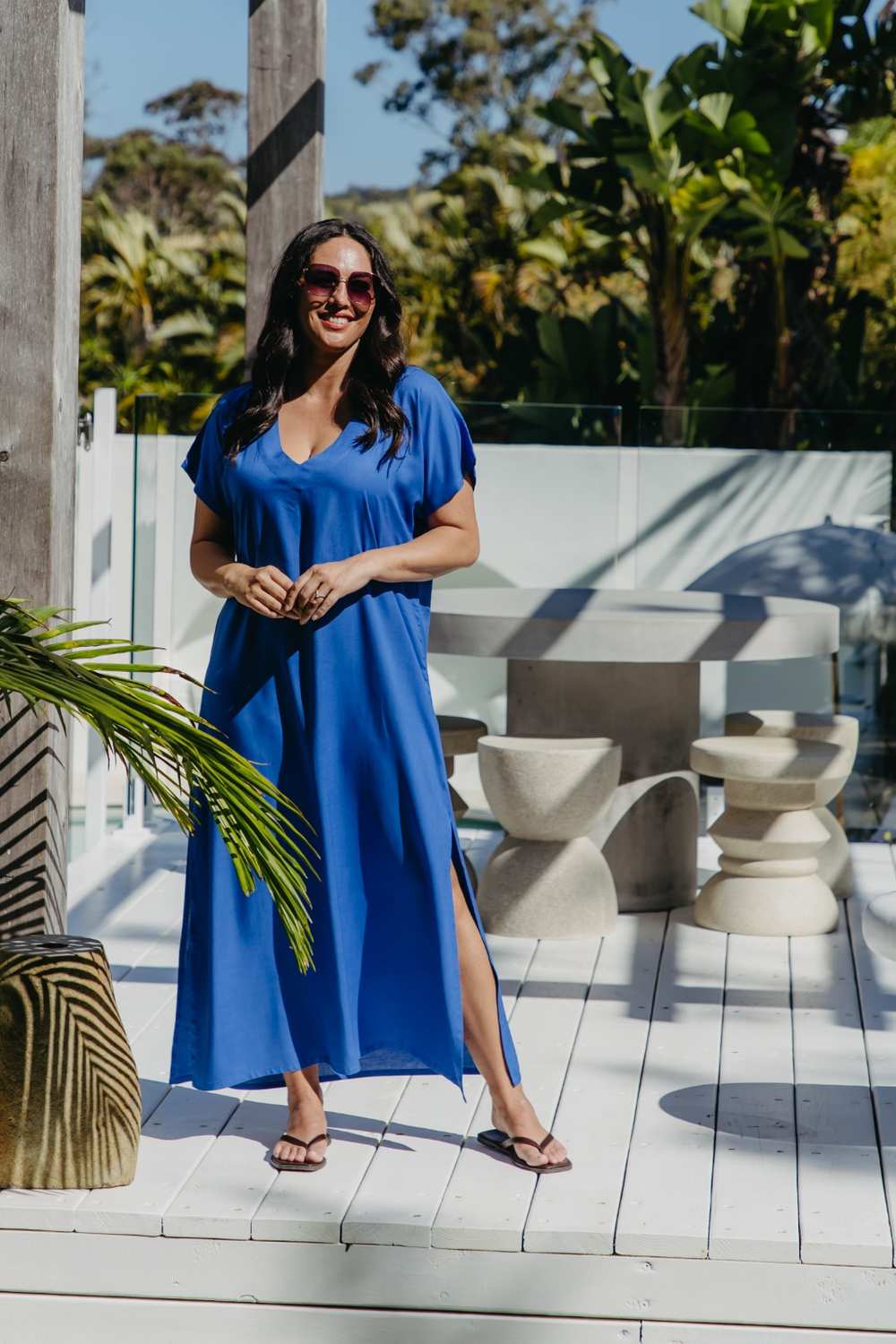 Lagoon Blue long kaftan dress worn loose, showing the side split, V-neckline and full-length silhouette.