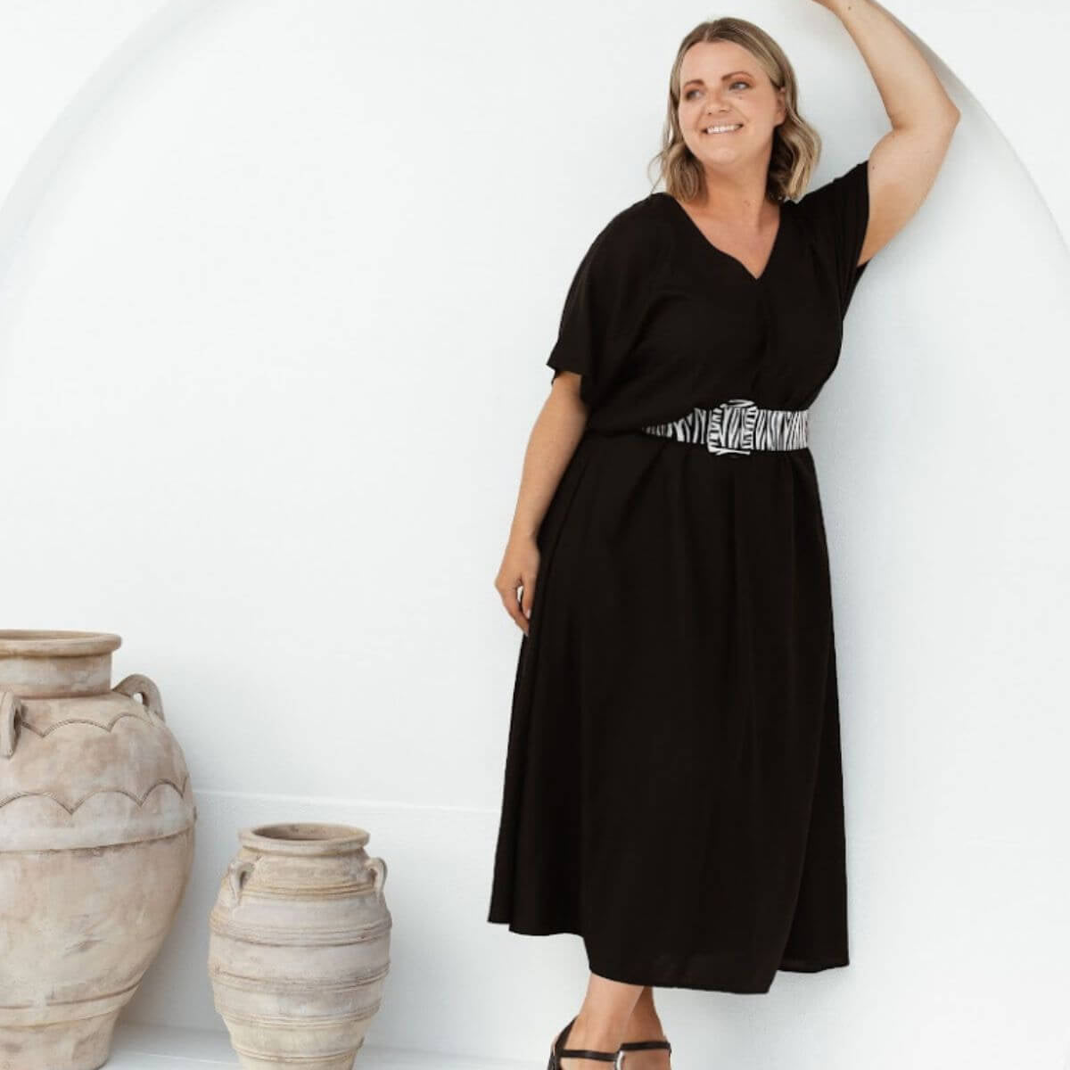 Woman wearing a relaxed black maxi resort dress