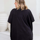 Back view of black kimono cape showing below-hip length