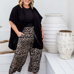 Drape detail of Black Kimono Cape in size ML showing relaxed open-front silhouette and fluid movement