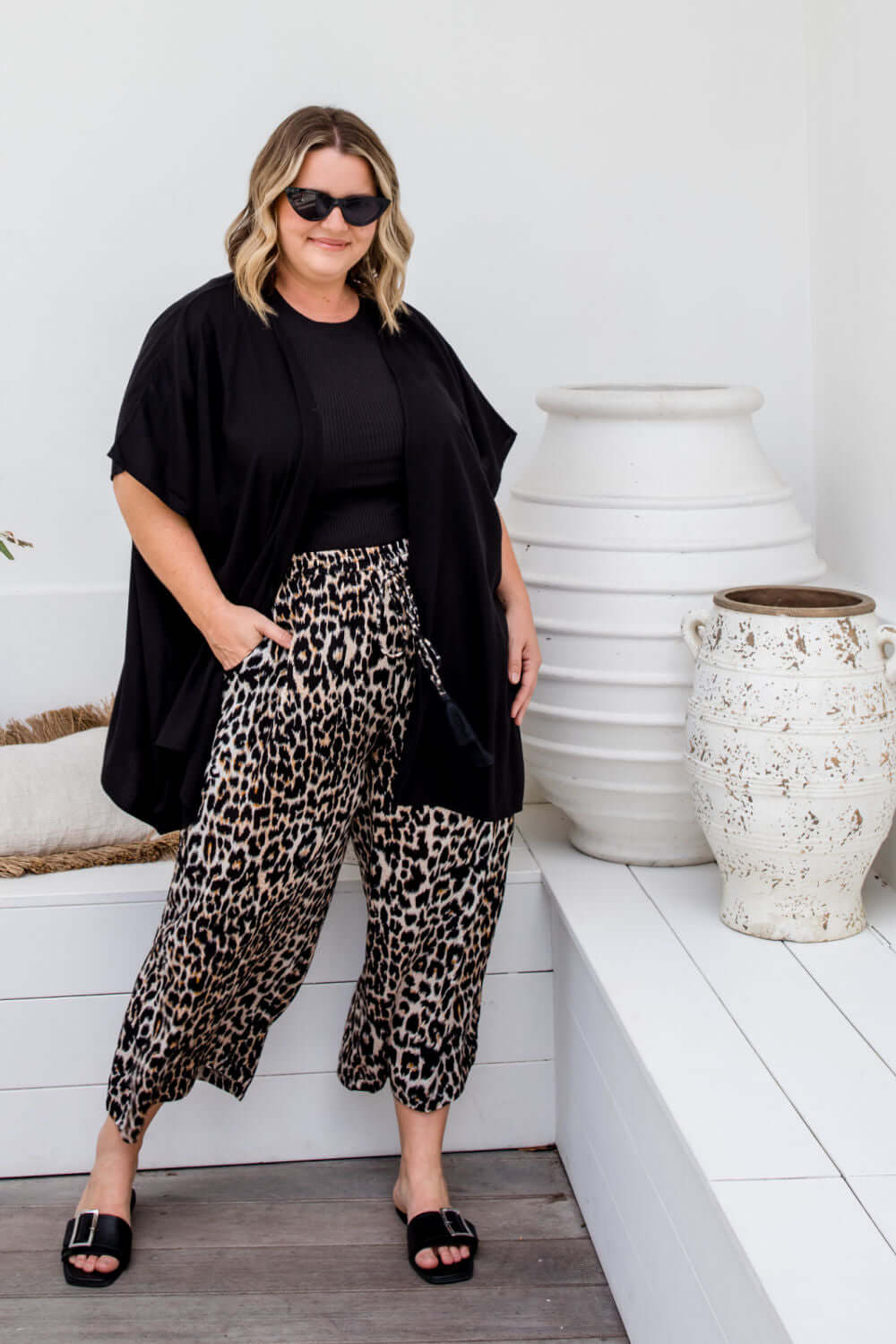 Drape detail of Black Kimono Cape in size ML showing relaxed open-front silhouette and fluid movement