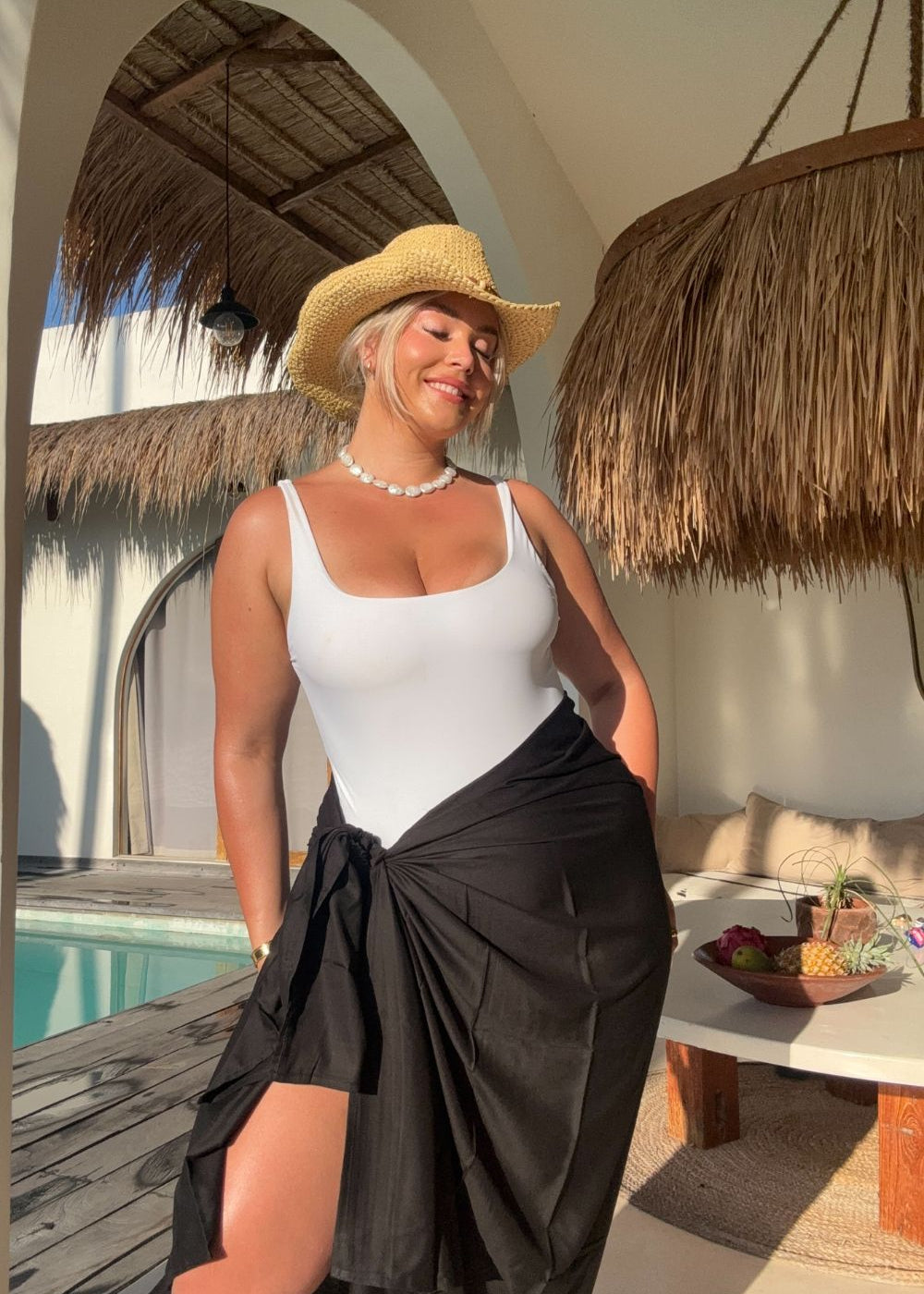 woman wearing xl black sarong at Bali pool villa