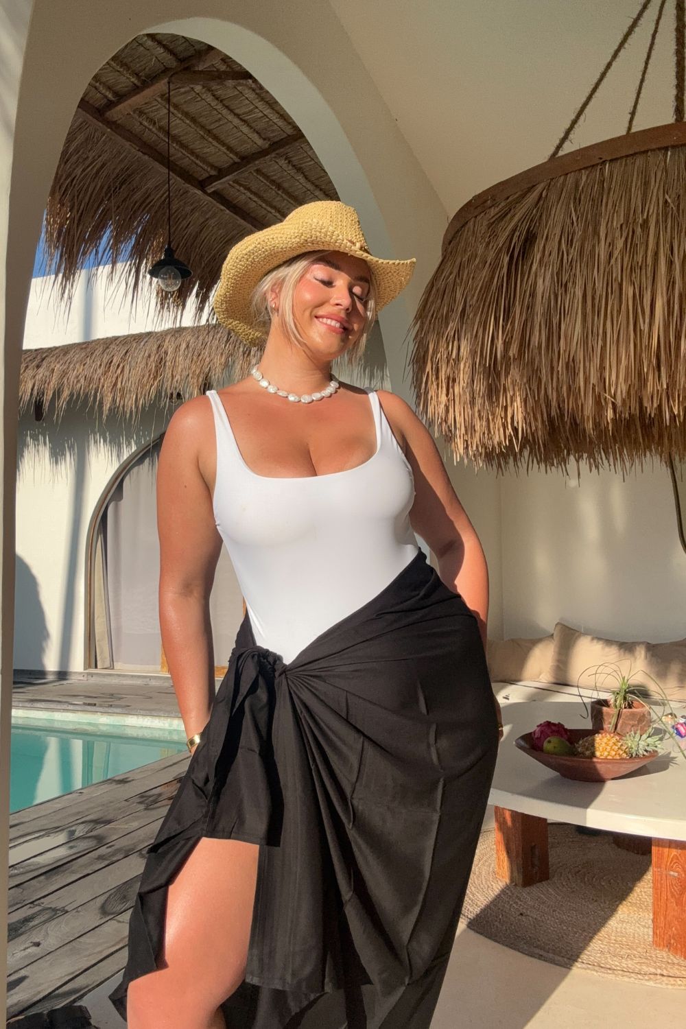 woman wearing xl black sarong at Bali pool villa