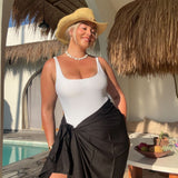 woman wearing xl black sarong at Bali pool villa