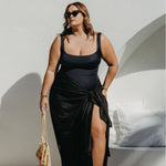 lady wearing black sarong poolside