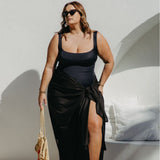 lady wearing black sarong poolside