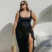 lady wearing black sarong poolside