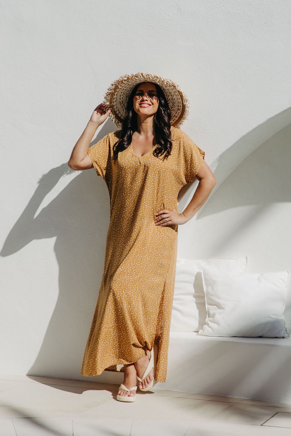 Angled view of the Caramel Scatter Dot Maxi Dress showing relaxed fit on SM model