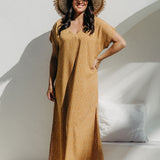 Front view of Caramel Scatter Dot Maxi Dress worn by size SM curve model