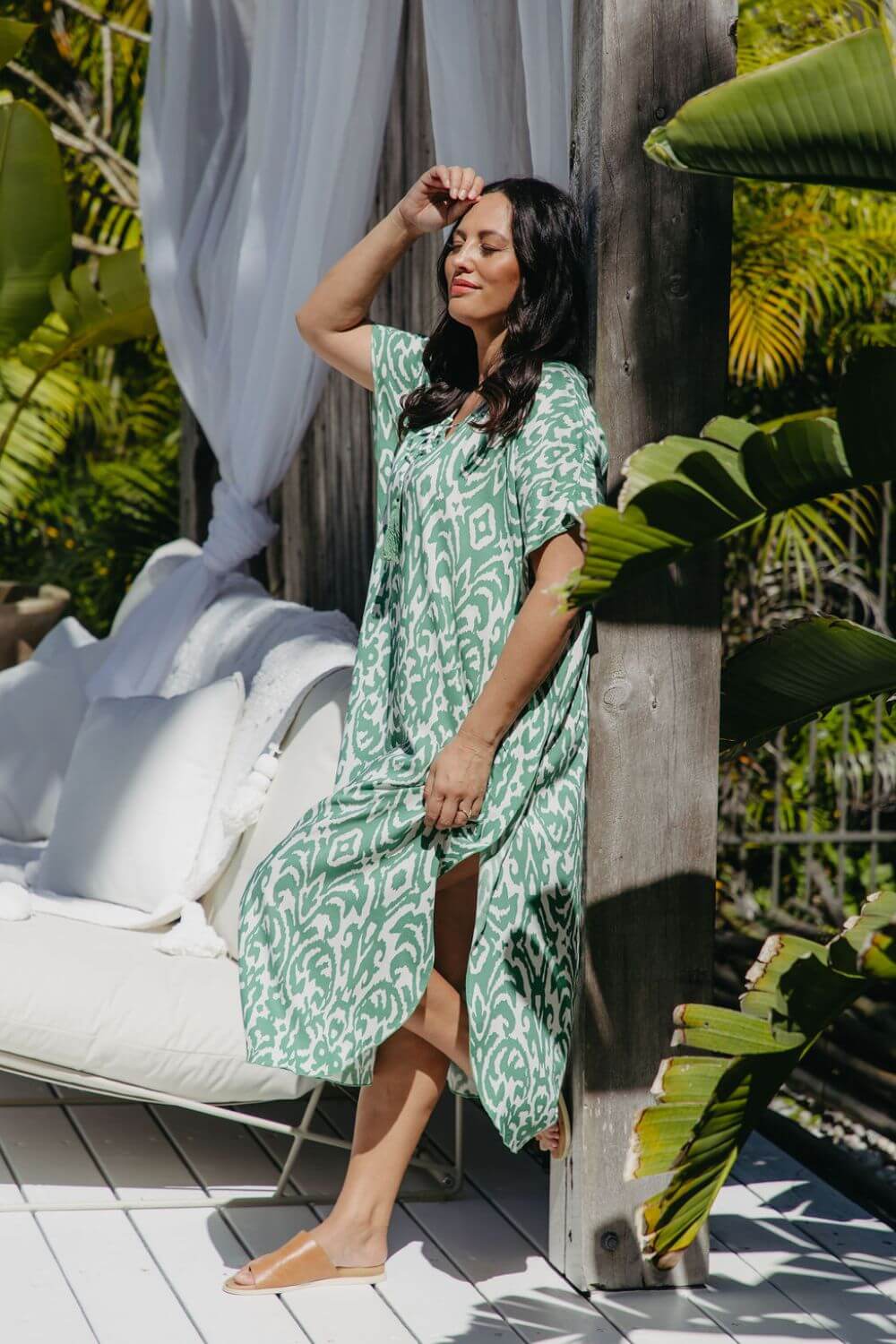 Side view of emerald green and white Sorrento print kaftan dress
