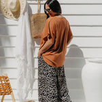 Partial back view of Alisha wearing Mocha Mousse Kaftan Top size S/M – showing drape and length