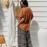 Partial back view of Alisha wearing Mocha Mousse Kaftan Top size S/M – showing drape and length
