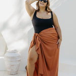 Kate in XL Mocha Mousse sarong, front-on wrap style with smooth no-gap coverage, beside the pool