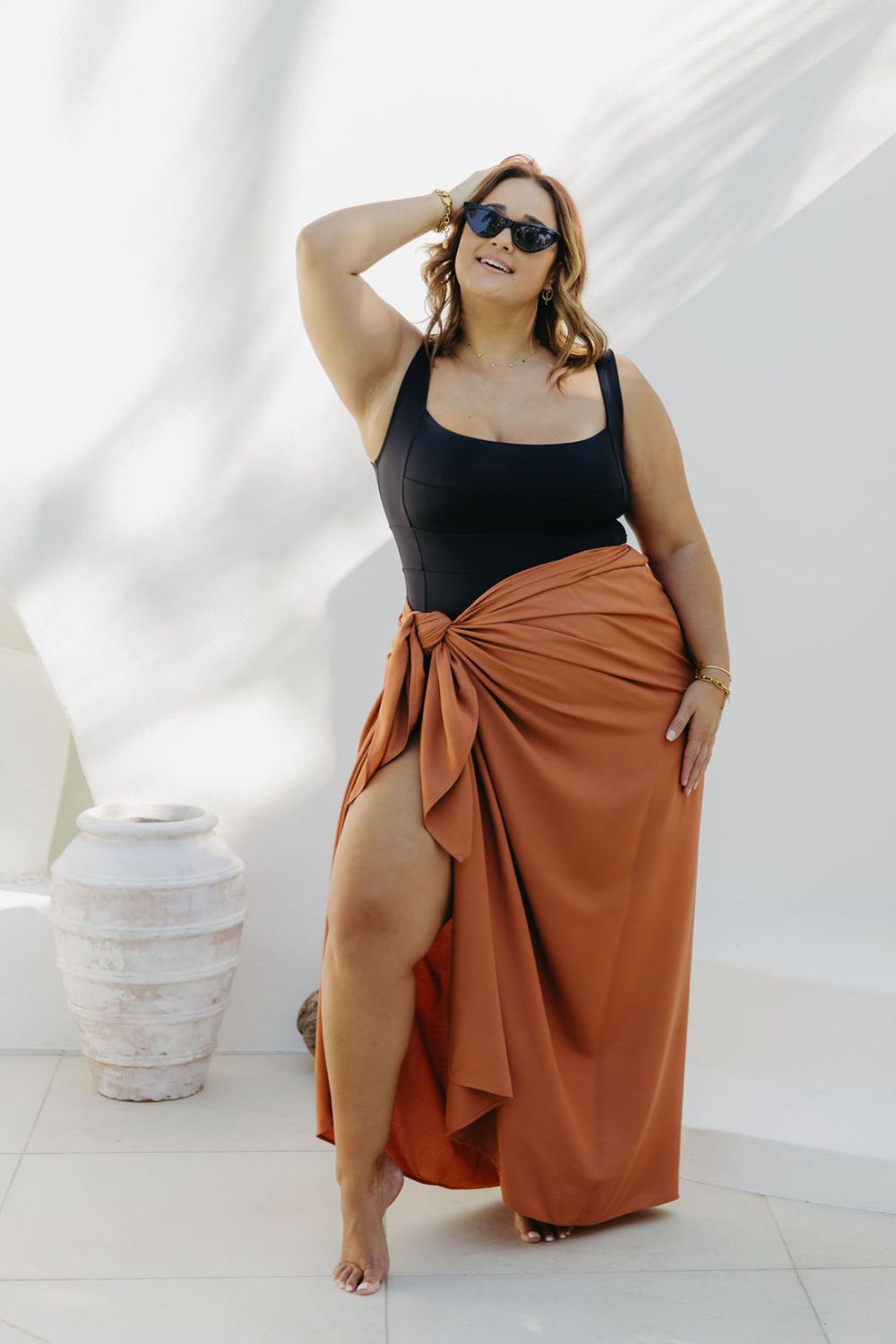 Kate in XL Mocha Mousse sarong, front-on wrap style with smooth no-gap coverage, beside the pool