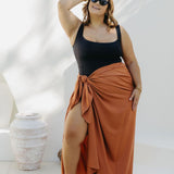 Kate in XL Mocha Mousse sarong, front-on wrap style with smooth no-gap coverage, beside the pool
