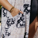 Maxi kimono duster styled open over swimmers at the beach with breezy movement