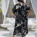 lady wearing resort style maxi dress in  outdoor bbq area
