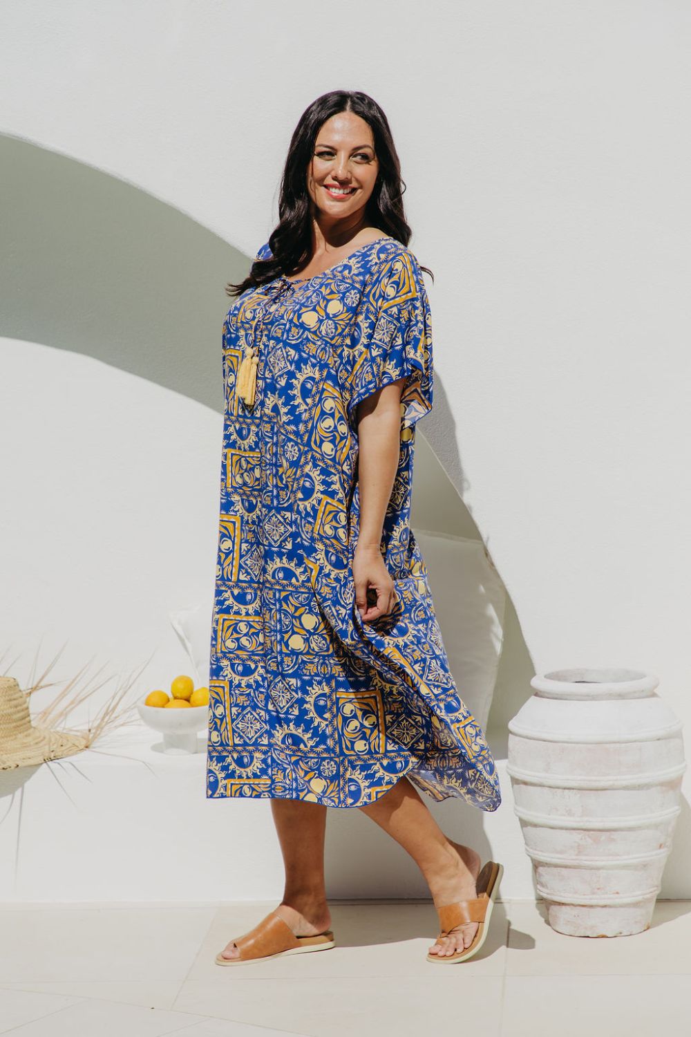 Lady wearing a Limoncello inspired resort wear in Italian setting