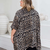 Back view of leopard print kimono cape showing below-hip length