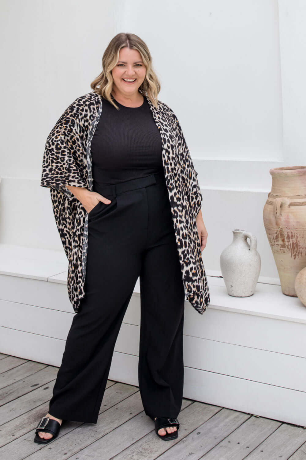 Front view of leopard print kimono cape with relaxed open drape