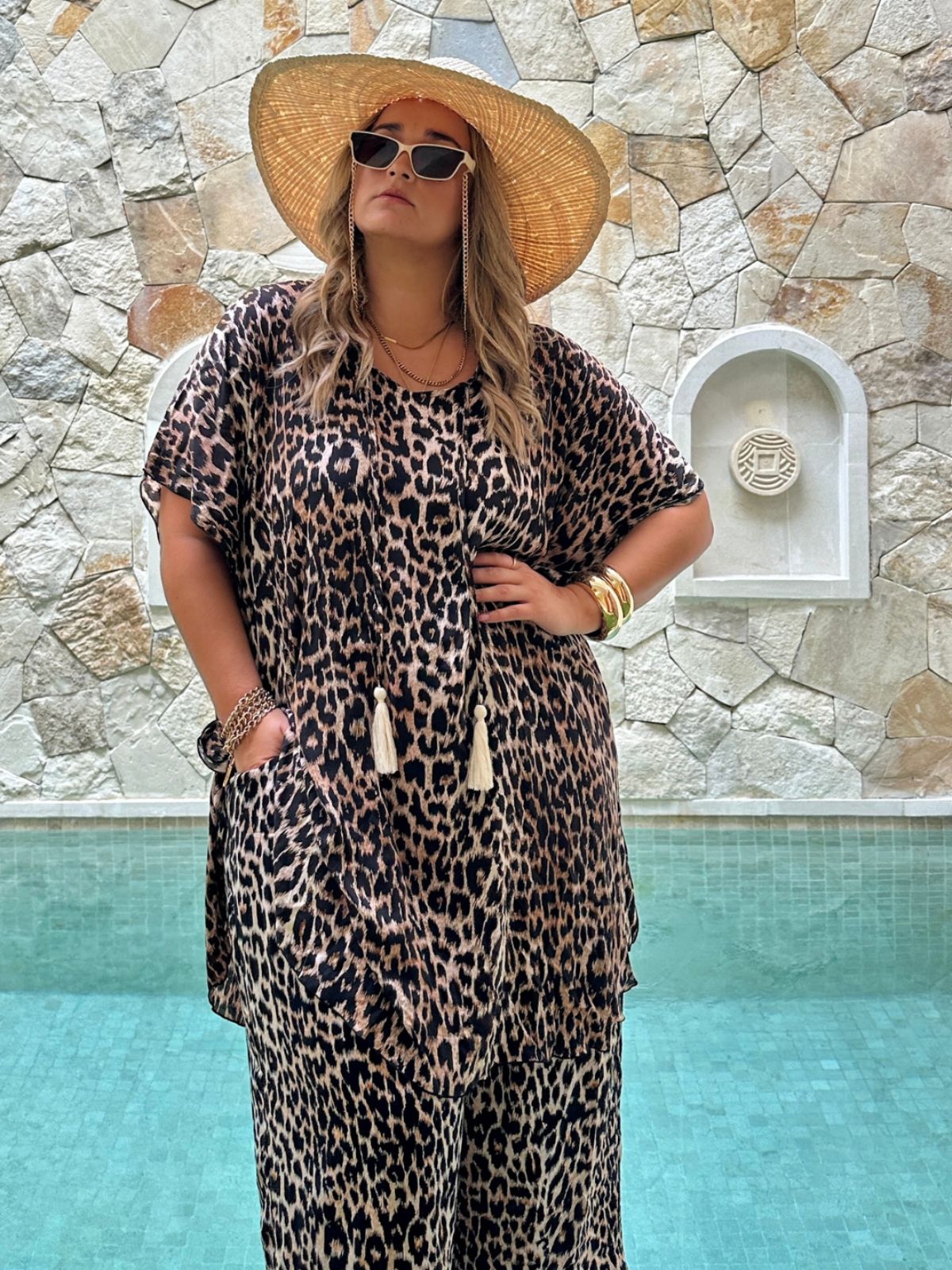 Woman wearing Signature Leopard Kaftan Top with matching Palazzo Pants