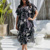 Woman wearing black and cream long kaftan in outdoor patio area