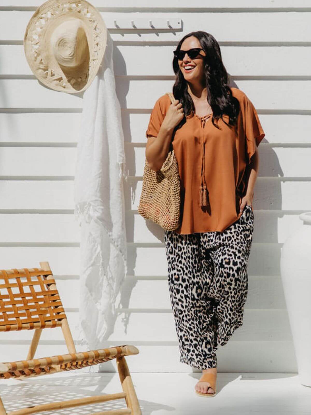 Size SM model wearing mocha kaftan top with leopard print palazzo pants as a matching co-ord set