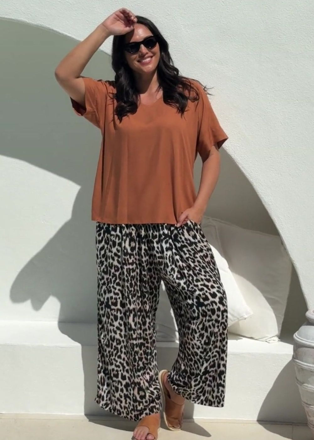 lady wearing casual summer outfit set of Palazzo Pants in Leopard Print paired with Mocha Mousse Blouse Top