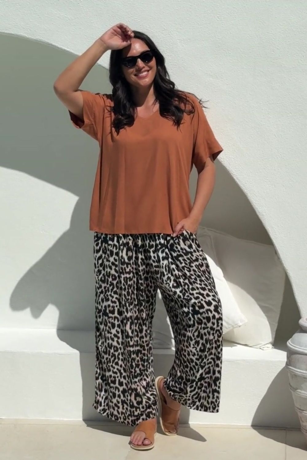 lady wearing casual summer outfit set of Palazzo Pants in Leopard Print paired with Mocha Mousse Blouse Top