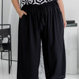 Close-up of black Palazzo Pants front – elastic waistband and drawstring tie detail