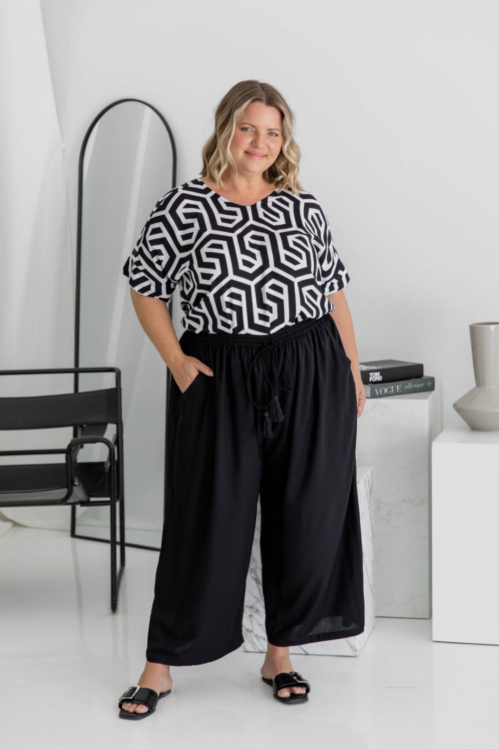 Amanda wearing black Palazzo Pants size L – full front view showing elastic waistband, drawstring, and pocket styling