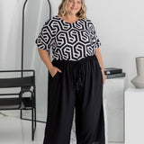 Amanda wearing black Palazzo Pants size L – full front view showing elastic waistband, drawstring, and pocket styling