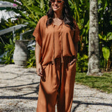 Front view of Alisha in Mocha Mousse Palazzo Pants size M styled with matching kaftan top tucked