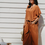 Partial side view of Alisha in Mocha Mousse Palazzo Pants size M showing functional side pocket detail