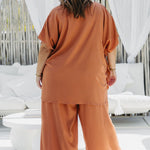 Back view of Kate wearing Mocha Mousse Palazzo Pants size XL – relaxed fit wide-leg resort trousers
