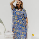 Woman wearing a Limoncello inspired Long Summer Dress enjoying dappled sunlight in Amalfi coast resort