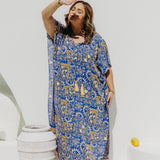 Woman wearing a Limoncello inspired Long Summer Dress enjoying dappled sunlight in Amalfi coast resort