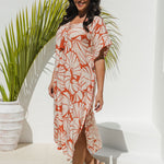 model in Shell Maxi Kaftan in Pomegranate showing side split and kimono sleeve flow