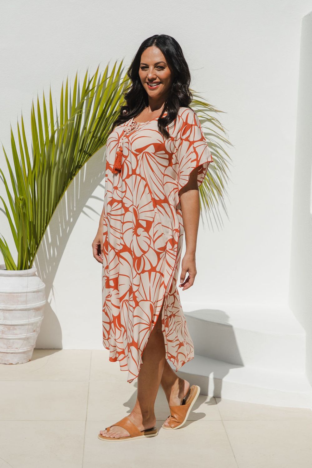 model in Shell Maxi Kaftan in Pomegranate showing side split and kimono sleeve flow