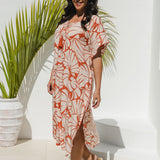 model in Shell Maxi Kaftan in Pomegranate showing side split and kimono sleeve flow