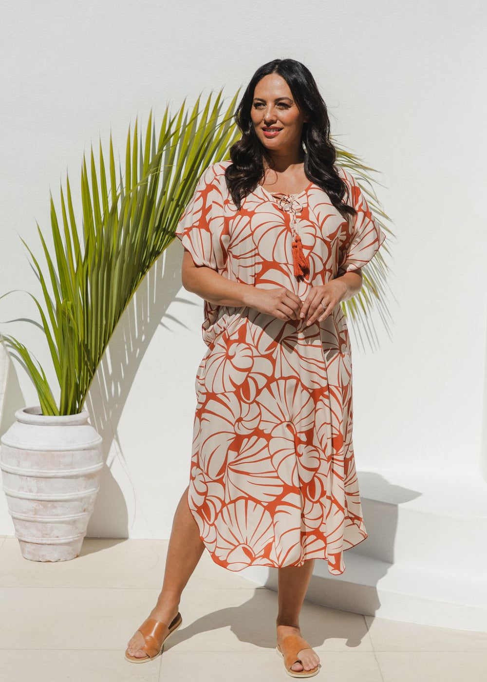Woman wearing Shell Maxi Kaftan in Pomegranate with bold shell print