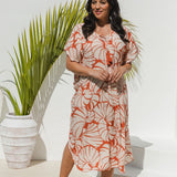 Woman wearing Shell Maxi Kaftan in Pomegranate with bold shell print