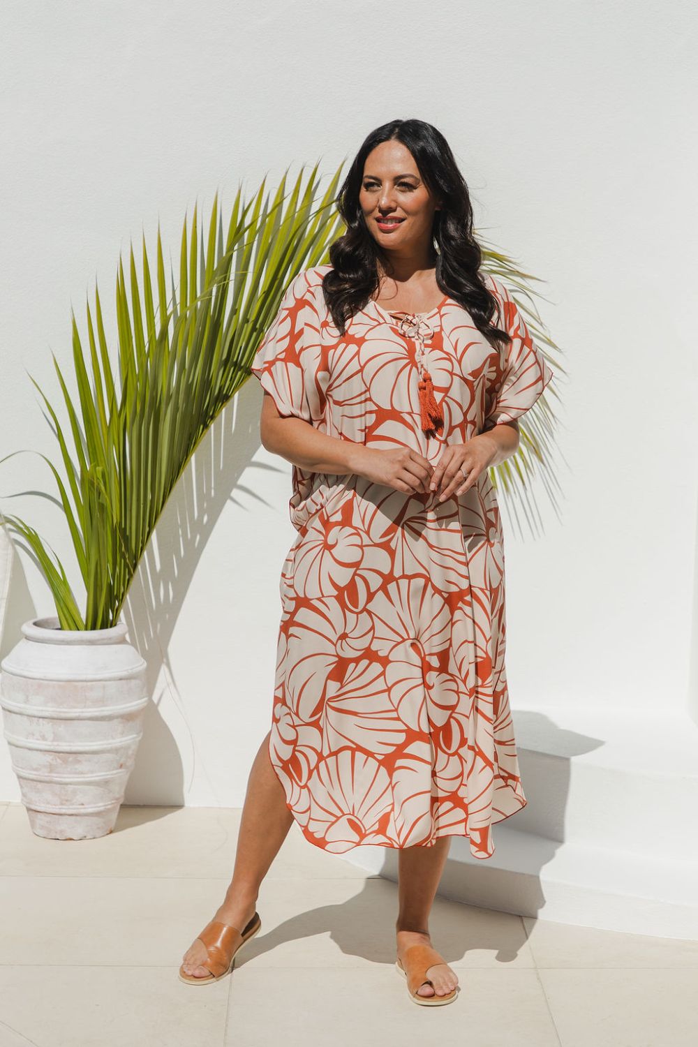 Woman wearing Shell Maxi Kaftan in Pomegranate with bold shell print