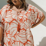 Close-up of handmade Pomegranate cotton tassels on V neckline